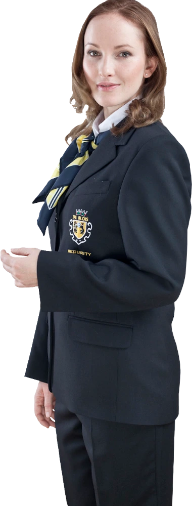 Person in schwarzer Sicherheitsuniform mit Wappen und Krawatte, steht seitlich und schaut in die Kamera.